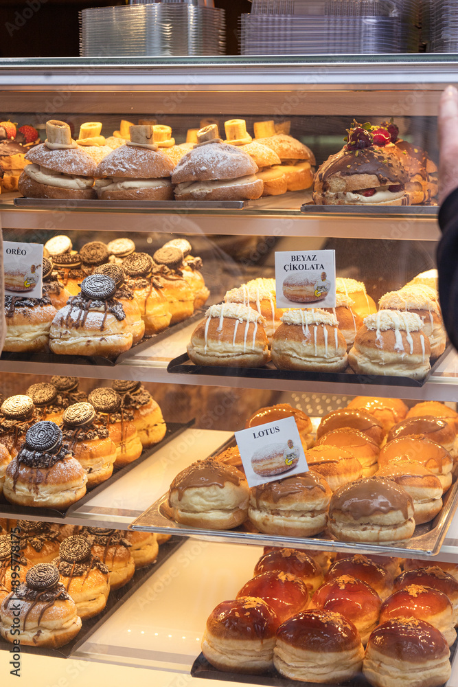 The counter of a pastry shop with pastries and cakes The counter of a pastry shop with pastries and cakes