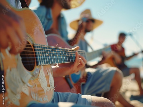 People playing guitars on the beach