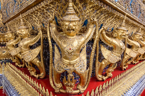 Golden decoration on the base of the main building of Wat Phra Kaew. photo