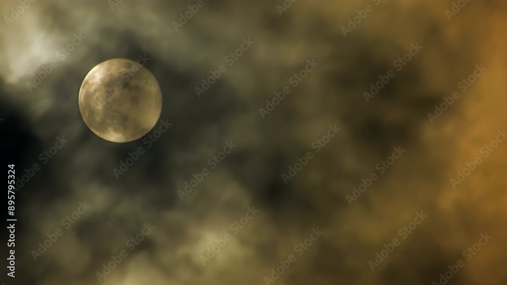 Serene Full Moon Surrounded by Clouds in the Night Sky is enchanting and atmospheric Serene Full Moon Surrounded by Clouds in the Night Sky is enchanting and atmospheric