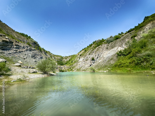 A wonderful landscape in the Carpathian mountains with a view of the lake between the rocks in sunny weather