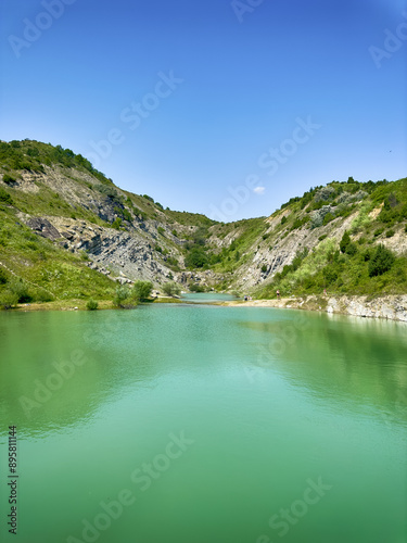 A wonderful landscape in the Carpathian mountains with a view of the lake between the rocks in sunny weather