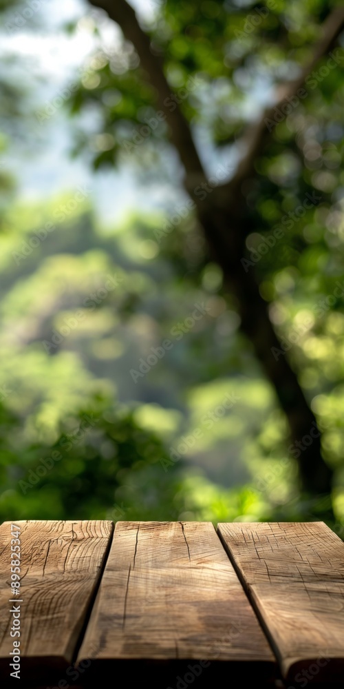 A wooden table with a view of a forest. The table is empty and the background is blurry A wooden table with a view of a forest. The table is empty and the background is blurry