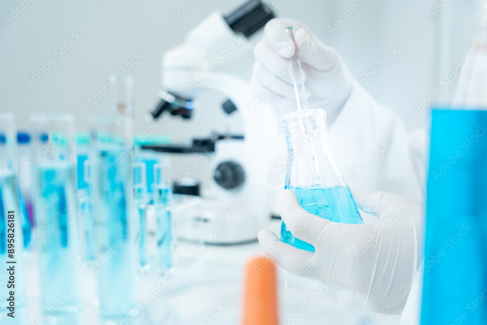 Scientist analyze biochemical samples in advanced scientific laboratory. Medical are mixing chemicals to test physical properties of cosmetic. develop viral. Biotechnology research in science lab... Scientist analyze biochemical samples in advanced scientific laboratory. Medical are mixing chemicals to test physical properties of cosmetic. develop viral. Biotechnology research in science lab...