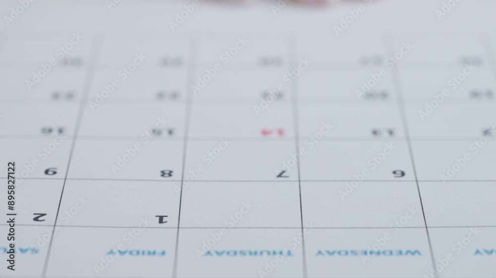 Red marker highlighting with heart calendar 14th day of the month on the paper page. Saint Valentines day date chosen in calendar. Red marker highlighting with heart calendar 14th day of the month on the paper page. Saint Valentines day date chosen in calendar.