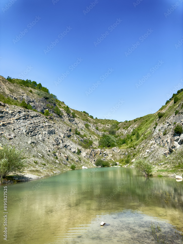 A wonderful landscape in the Carpathian mountains with a view of the lake between the rocks in sunny weather A wonderful landscape in the Carpathian mountains with a view of the lake between the rocks in sunny weather