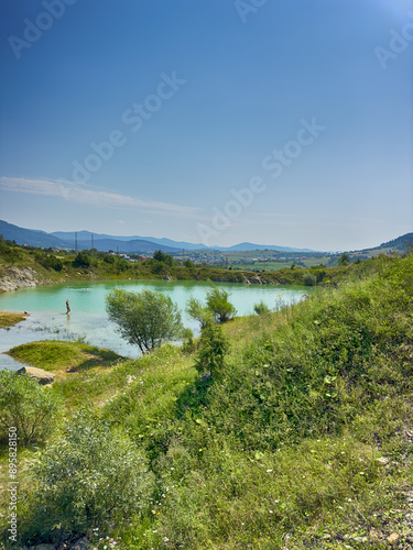 A wonderful landscape in the Carpathian mountains with a view of the lake between the rocks in sunny weather