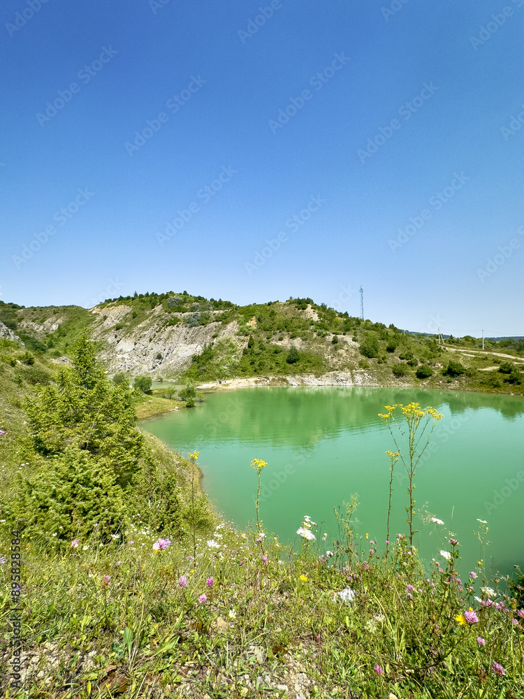 Naklejka premium A wonderful landscape in the Carpathian mountains with a view of the lake between the rocks in sunny weather