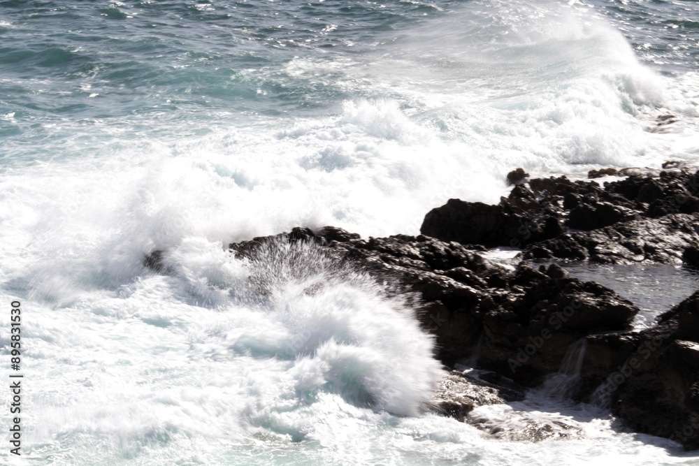Fototapeta premium evocative image of a rough sea hitting the rocks in Sicily