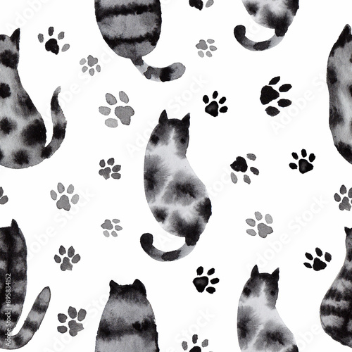 A seamless pattern with watercolor cats and paw prints in black and white, hand-painted spotted and tabby cats, sitting cats, view from behind