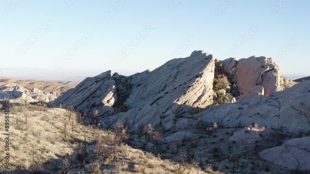 A wide shot of the Devil's Punchbowl rock formation in California, showing the rugged terrain and unique geological features of this iconic landmark. A wide shot of the Devil's Punchbowl rock formation in California, showing the rugged terrain and unique geological features of this iconic landmark.