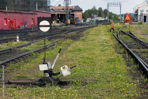 Old manual powered railroad switch with black and white details photo