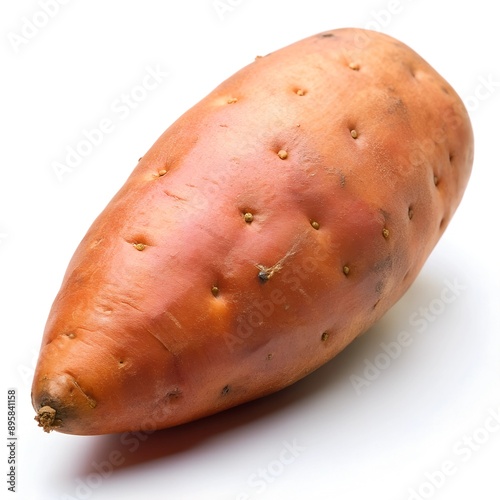 There is a sweet potato placed on a white surface