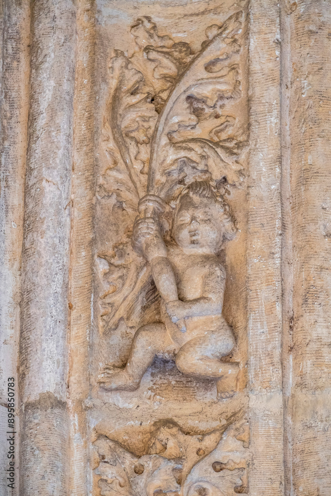 Naked cherub, cloister of the Monastery of San Juan de los Reyes, Toledo, Castilla-La Mancha, Spain Naked cherub, cloister of the Monastery of San Juan de los Reyes, Toledo, Castilla-La Mancha, Spain