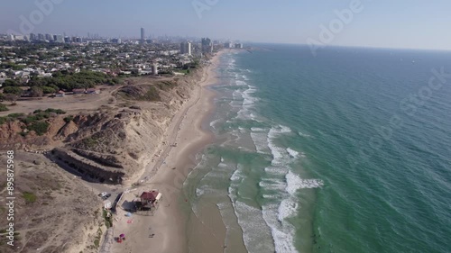 Aerial video over the coastline in Herzliya and the Sidna Ali Mosque in Israel photo