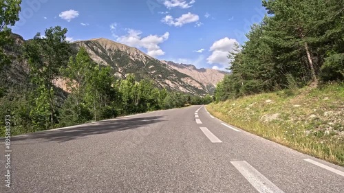 Mountain road in the south French alps with cyclist