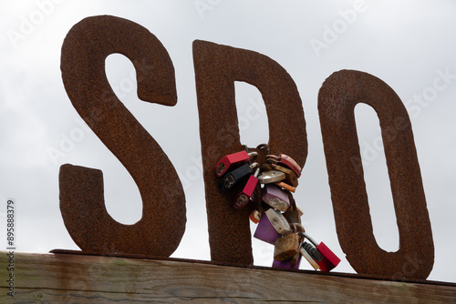 SPO - Liebesschlösser an einem Schild aus drei Buchstaben in Sankt Peter-Ording photo