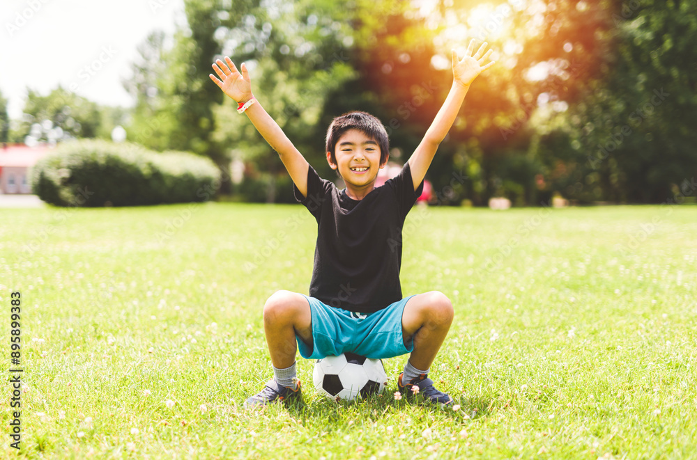 nice and handsome child boy play football outside nice and handsome child boy play football outside