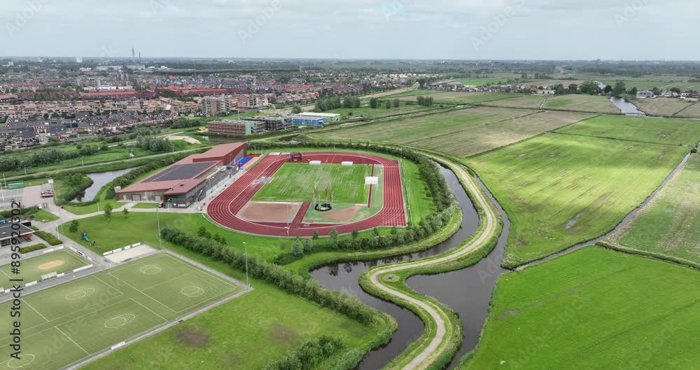 Athletics running track in Assendelft, The Netherlands, sports and exercise. Aerial drone view. Athletics running track in Assendelft, The Netherlands, sports and exercise. Aerial drone view.