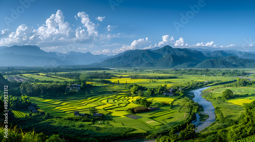 Expansive Rural Landscape with River, Forests, and Distant Mountains Under a Setting Sun