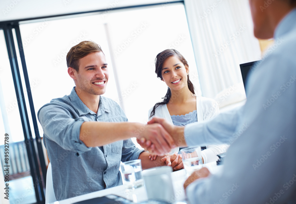 Office, businessman and handshake in consulting with couple for investment, planning and success. Happy, people and financial advisor with gesture for business deal, negotiation and equity agreement Office, businessman and handshake in consulting with couple for investment, planning and success. Happy, people and financial advisor with gesture for business deal, negotiation and equity agreement