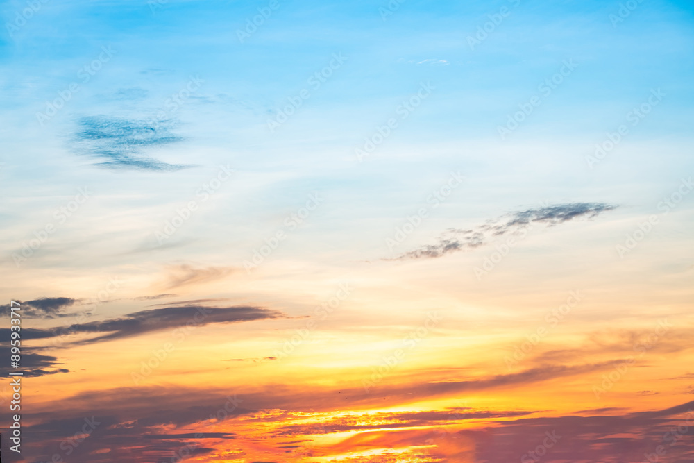 Fototapeta premium Beautiful , luxury soft gradient orange gold clouds and sunlight on the blue sky perfect for the background, take in everning,Twilight, Large size, high definition landscape photo