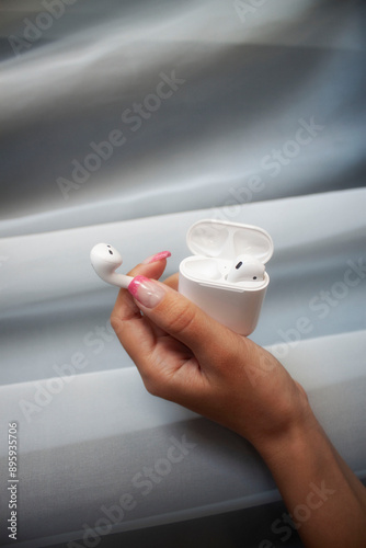 heand holding earphones photo