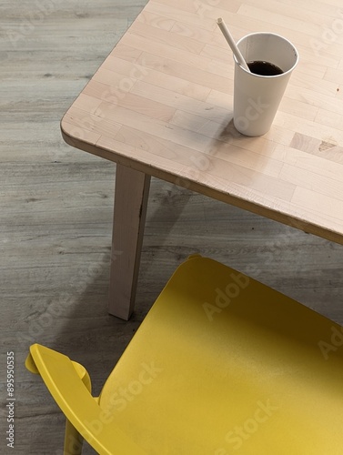 Cola soda cup on the table in summer