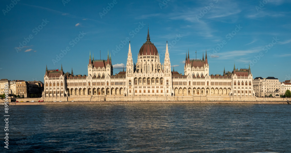 Fototapeta premium Sailing in front of the iconic Hungarian Parliament Building while ncruising the Danube river. Budapest, Hungary