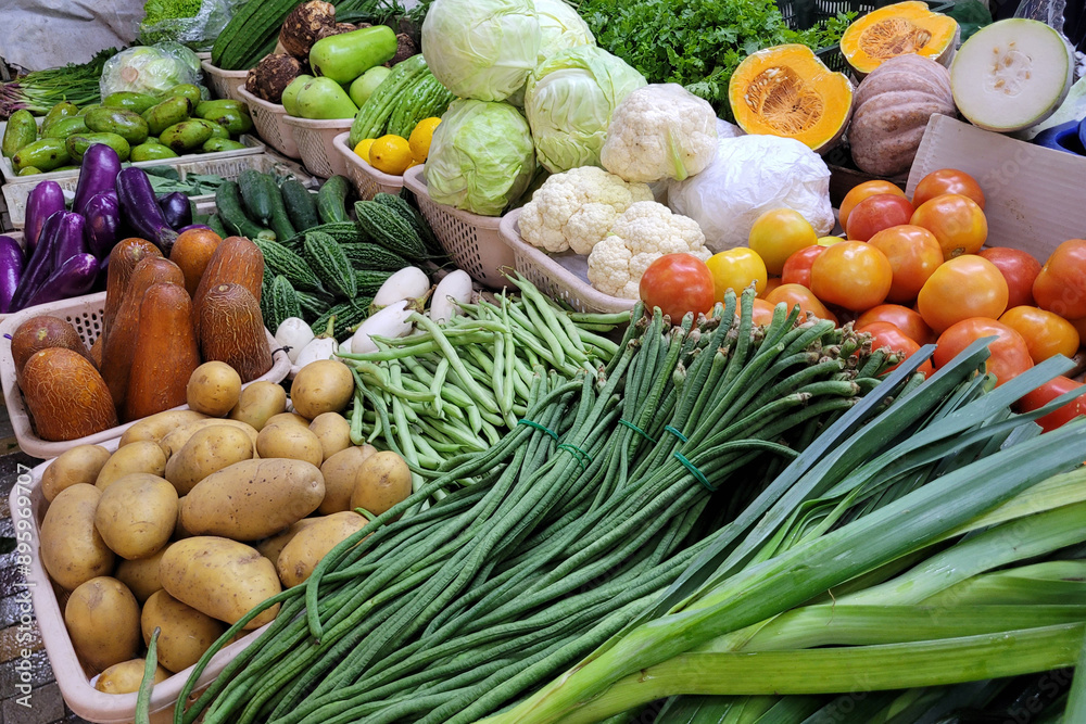 Fresh vegetables and fruits for sale in Asian farmer market stall Fresh vegetables and fruits for sale in Asian farmer market stall