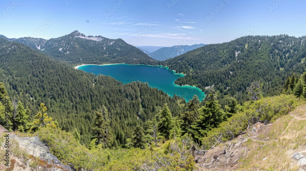 A clear blue mountain lake reflects the sky and surrounding snow-capped peaks on a sunny day. Lush green trees line the shores A clear blue mountain lake reflects the sky and surrounding snow-capped peaks on a sunny day. Lush green trees line the shores