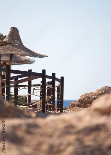 View on sunshades on beach in resort, Sharm El Sheikh, Red Sea coast, Egypt