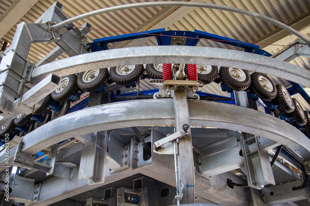 Obraz premium The mechanism of the cable car drive with rollers and metal guides. Technology, science, mechanics, mechanisms.