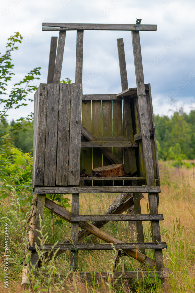wooden hunting structure with a ladder and a bench wooden hunting structure with a ladder and a bench