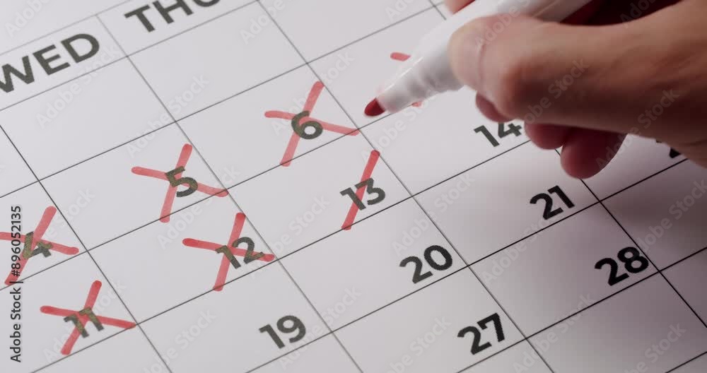 Close-up image of a hand marking off days on a calendar with a red marker, representing progress, schedule, time management, and countdown. Hand Crossing Off Days On Calendar With Red Marker Close-up image of a hand marking off days on a calendar with a red marker, representing progress, schedule, time management, and countdown. Hand Crossing Off Days On Calendar With Red Marker