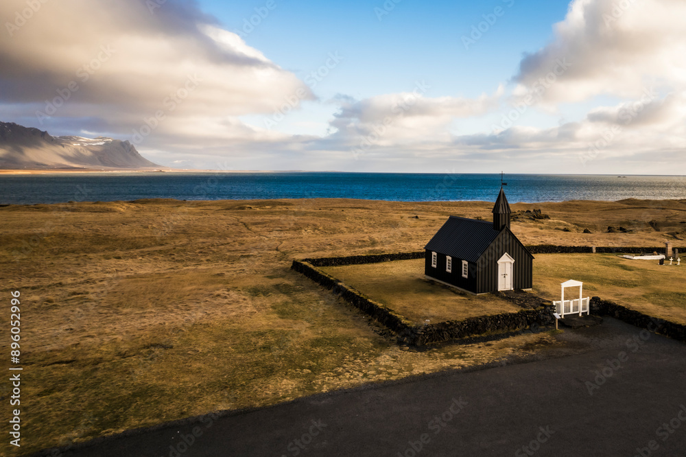 Aerial view of remote black church Budakirkja in Budir, Snaefellsbaer, Iceland. Aerial view of remote black church Budakirkja in Budir, Snaefellsbaer, Iceland.