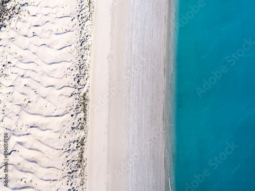 Aerial view of pristine turquoise beach and clear water, Eighty Mile Beach, Western Australia, Australia. photo