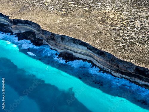 Aerial view of dramatic rocky coast with turquoise water at Baxter Cliffs, Great Australian Bight, Australia. photo