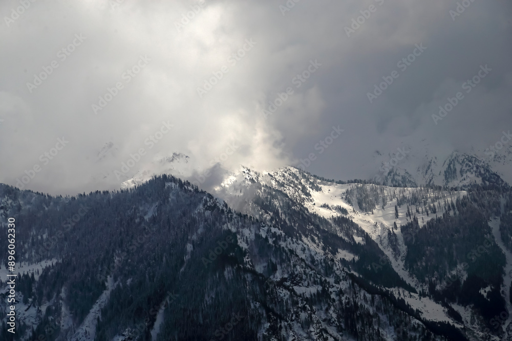 Aerial view of snowy mountains and clouds in Kashmir region, Pakistan. Aerial view of snowy mountains and clouds in Kashmir region, Pakistan.