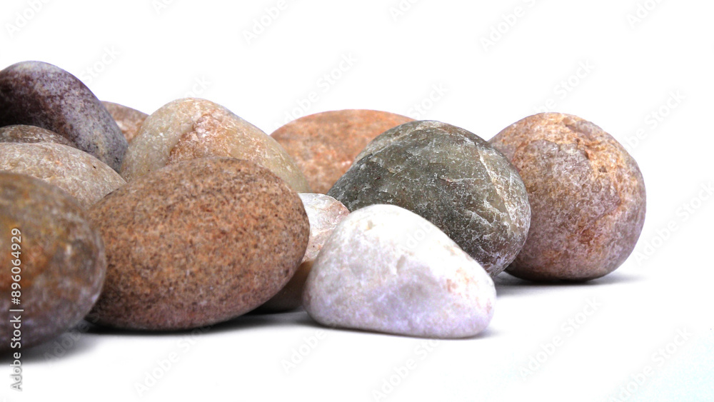 Pebbles piled on white background	