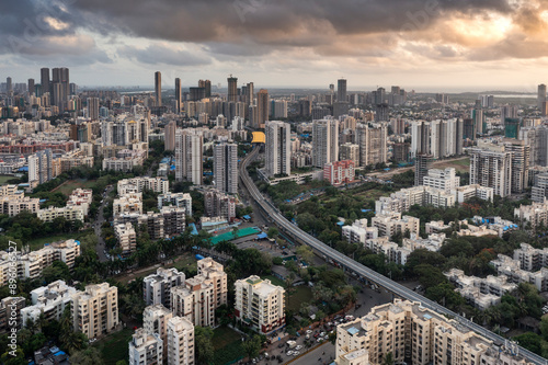 Aerial view of dense cityscape with skyscrapers and sunset, Borivali West, Mumbai, India. photo