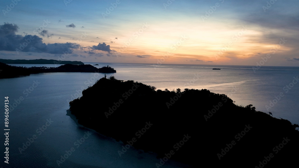 Aerial view of serene tropical island at dusk, Fiji. Aerial view of serene tropical island at dusk, Fiji.