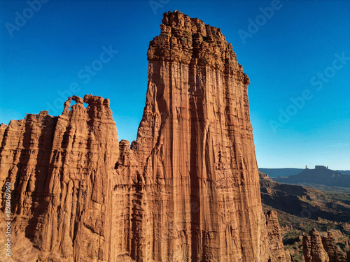 Aerial view of Mother Superior rock and Castleton in red rock desert landscape, Moab, Utah, United States.