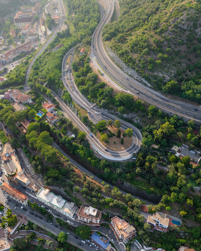 Aerial view of town with winding road and mountain, Vietri sul Mare, Campania, Italy. photo