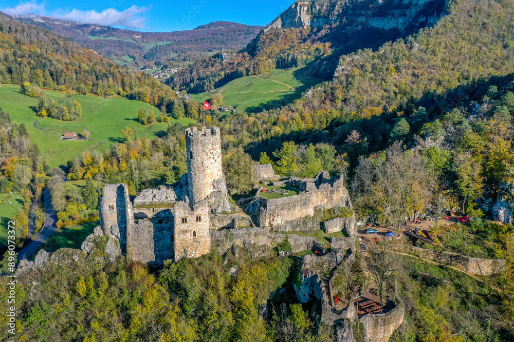 Aerial view of historic castle ruins surrounded by mountains and forest, Balsthal, Switzerland. Aerial view of historic castle ruins surrounded by mountains and forest, Balsthal, Switzerland.