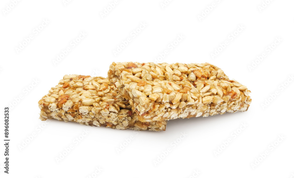Sunflower seed Gozinaki or Kozinaki bar, traditional Georgian confection made of caramelized nuts or seeds, isolated on white background Sunflower seed Gozinaki or Kozinaki bar, traditional Georgian confection made of caramelized nuts or seeds, isolated on white background