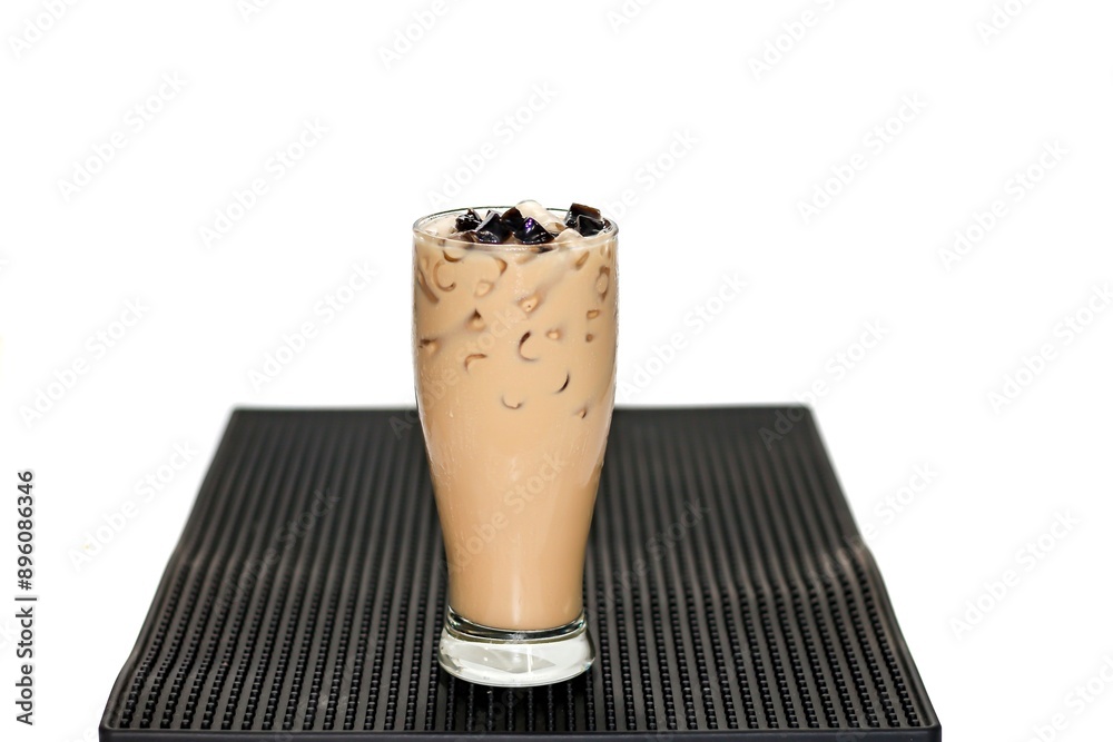 Bubble Milk Tea put on bar mat with white background and isolation concept.sweet and delicious with tea milk. Bubble Milk Tea put on bar mat with white background and isolation concept.sweet and delicious with tea milk.