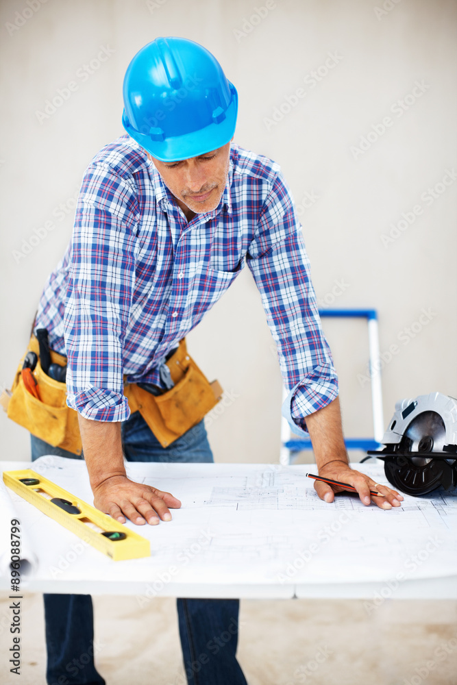 Architect, blueprint and reading with mature contractor and man thinking with floor plan design. Engineering, handyman and construction paper for job in builder workshop with home renovation project Architect, blueprint and reading with mature contractor and man thinking with floor plan design. Engineering, handyman and construction paper for job in builder workshop with home renovation project