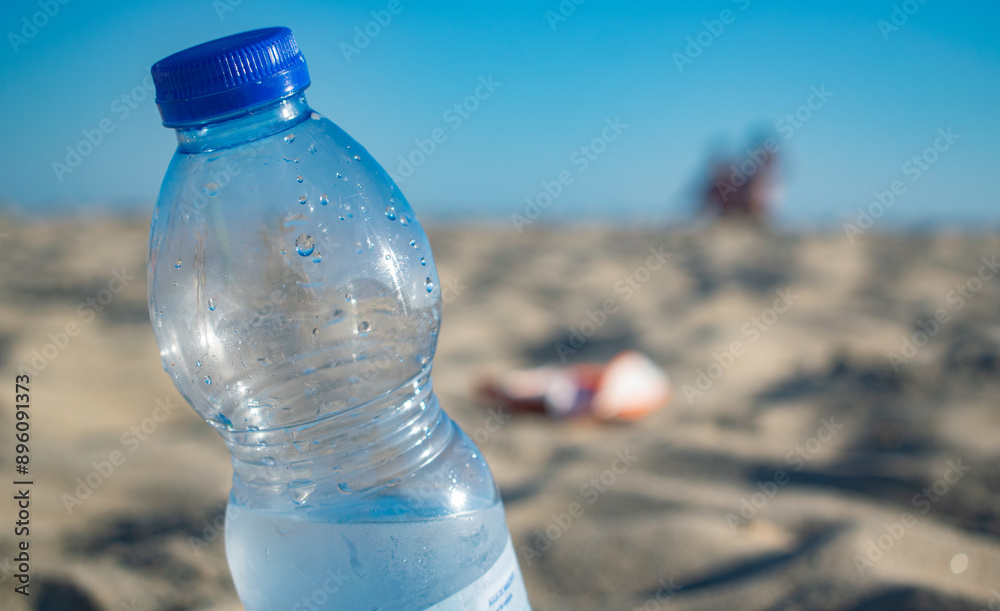 Bottle of water on the beach