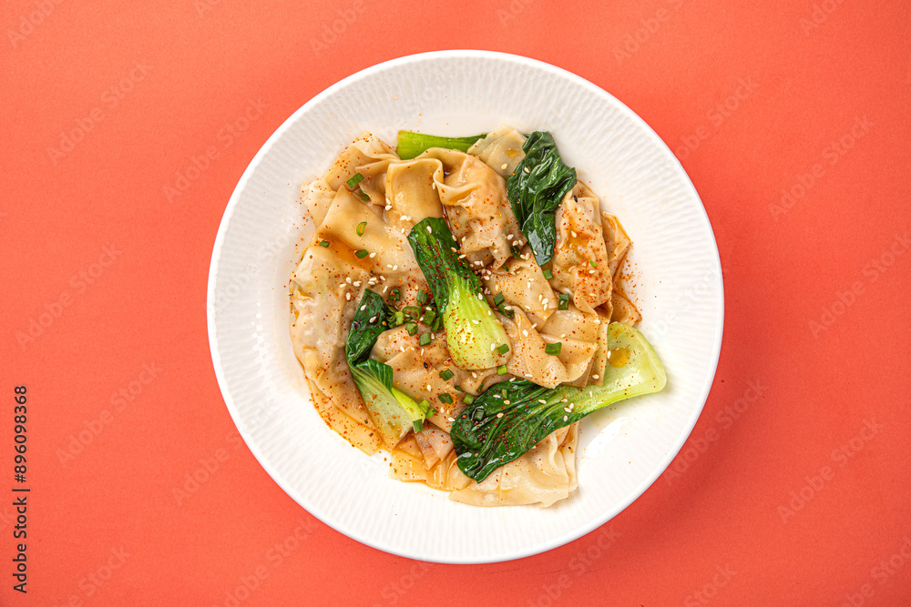 Portion of appetizing asian wonton dumplings with bok choi Portion of appetizing asian wonton dumplings with bok choi